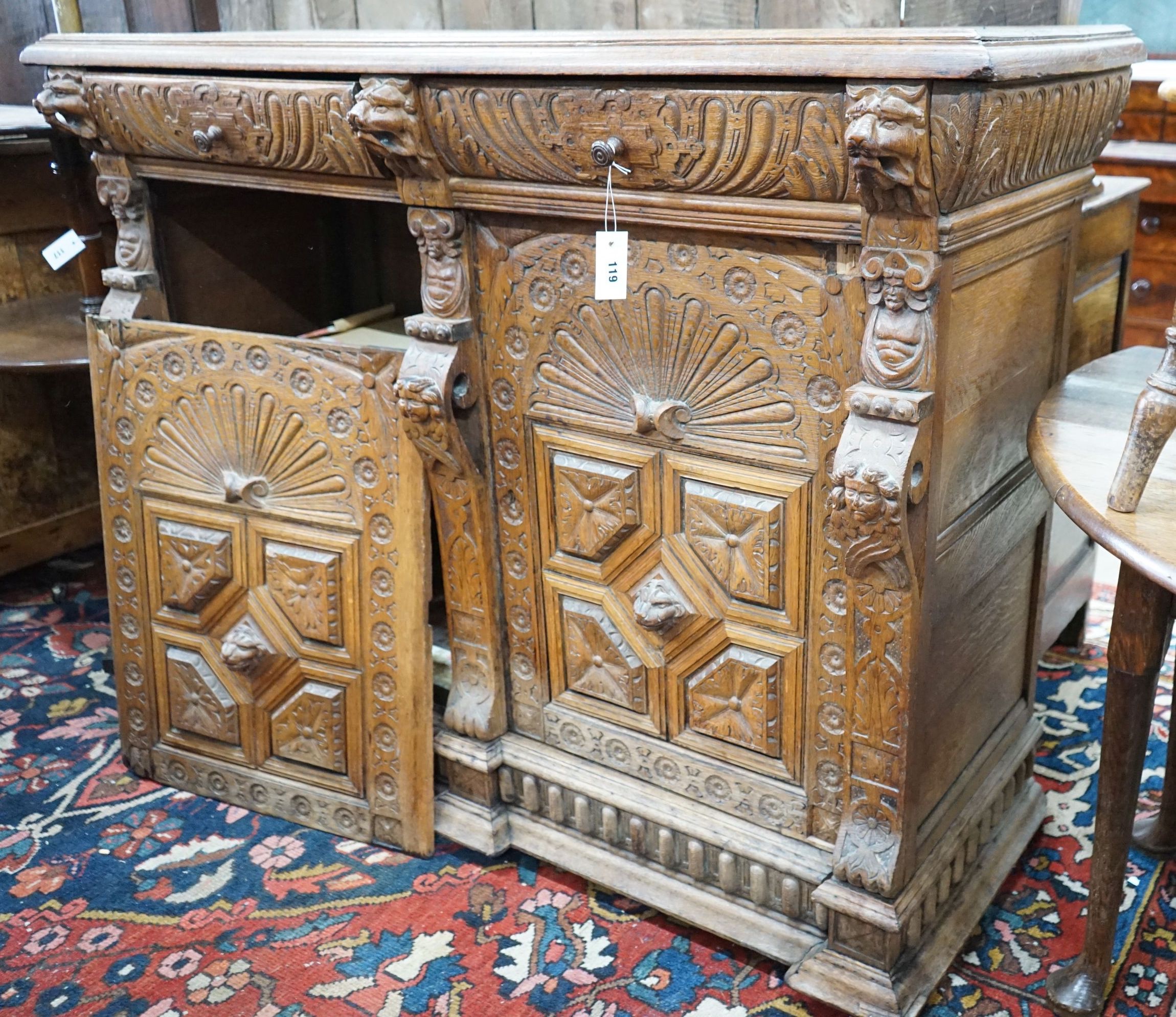 A 19th century Flemish carved oak buffet, length 140cm, depth 55cm, height 110cm